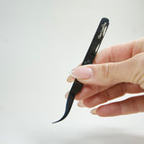 curved shaped black tweezer