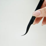 curved shaped black tweezer